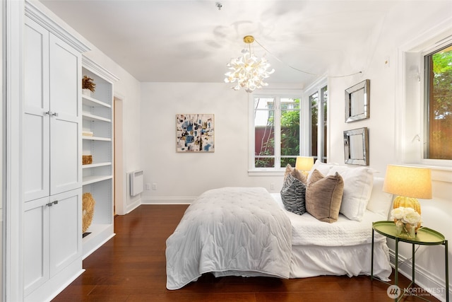 719 2nd Ave W Unit 101, Seattle, WA 98119 - bedroom with dark wood-style floors and a chandelier