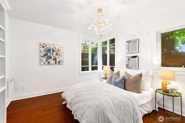 719 2nd Ave W Unit 101, Seattle, WA 98119 - bedroom featuring a chandelier and wood finished floors