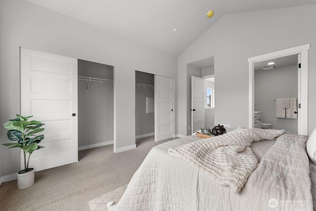 15726 40th Ave W Unit A4, Lynnwood, WA 98087 - bedroom with multiple closets, light carpet, lofted ceiling, and ensuite bathroom