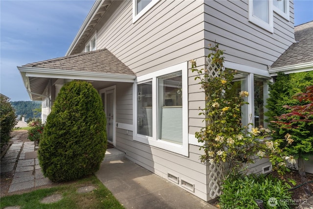 95 Martingale Pl, Port Ludlow, WA 98365 - view of property exterior with roof with shingles