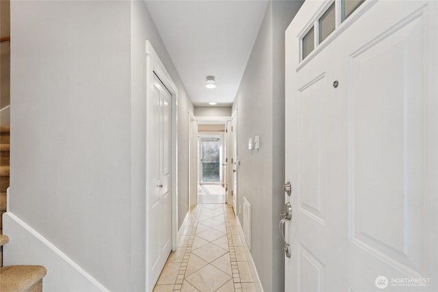 9503 Ashworth Ave N Unit B, Seattle, WA 98103 - corridor featuring light tile patterned floors, inlaid floor details, and stairs