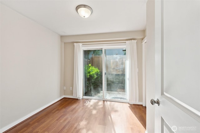 9503 Ashworth Ave N Unit B, Seattle, WA 98103 - spare room with wood finished floors and baseboards