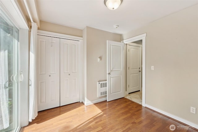 9503 Ashworth Ave N Unit B, Seattle, WA 98103 - unfurnished bedroom featuring light wood-type flooring and a closet