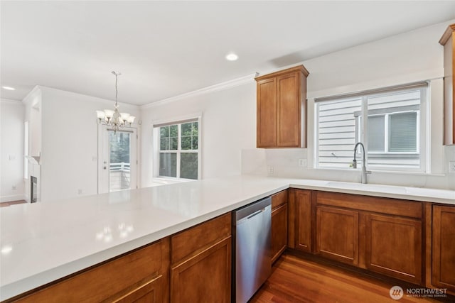 9503 Ashworth Ave N Unit B, Seattle, WA 98103 - kitchen featuring dishwasher, crown molding, a chandelier, light countertops, and brown cabinets