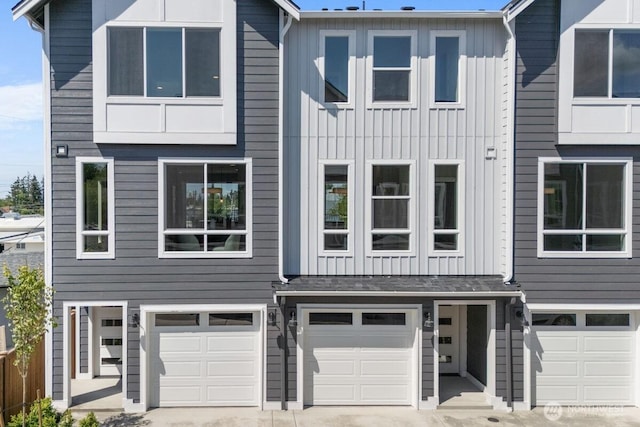 15726 40th Ave W Unit A6, Lynnwood, WA 98087 - multi unit property featuring a garage, board and batten siding, and driveway