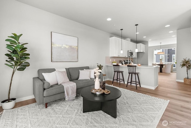 15726 40th Ave W Unit A6, Lynnwood, WA 98087 - living room featuring light wood-type flooring and recessed lighting