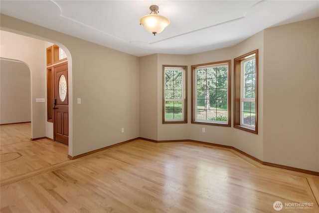 3941 16th Ln NE, Olympia, WA 98506 - empty room featuring arched walkways and light wood finished floors
