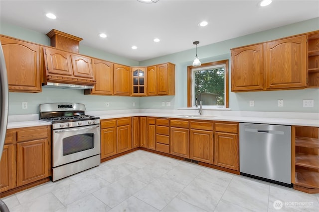 3941 16th Ln NE, Olympia, WA 98506 - kitchen featuring appliances with stainless steel finishes, open shelves, under cabinet range hood, light countertops, and brown cabinetry