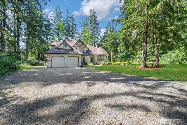 3941 16th Ln NE, Olympia, WA 98506 - view of front of home with a garage, gravel driveway, and a front lawn