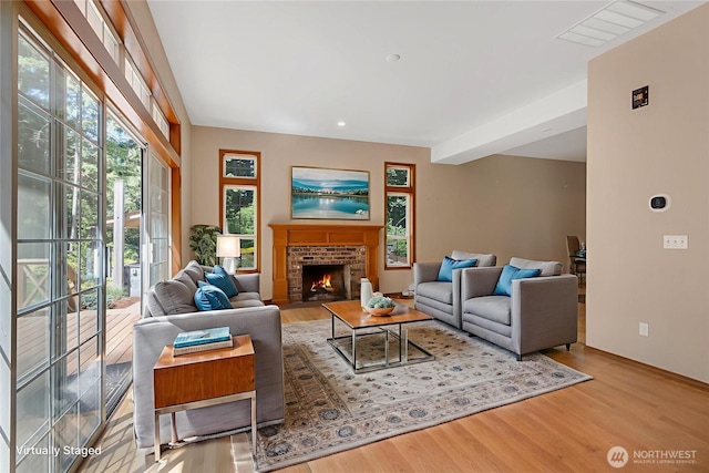3941 16th Ln NE, Olympia, WA 98506 - living room featuring wood finished floors and a fireplace