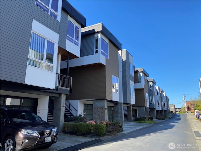 213 4th Ct S, Kirkland, WA 98033 - view of asphalt road featuring stairway and a residential view