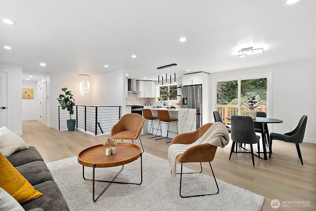 6347 121st Ave SE, Bellevue, WA 98006 - living room featuring light wood-style flooring and recessed lighting