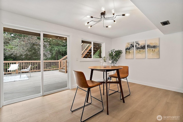 6347 121st Ave SE, Bellevue, WA 98006 - dining space featuring a chandelier, stairs, and light wood finished floors