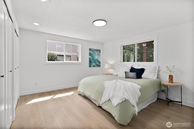 6347 121st Ave SE, Bellevue, WA 98006 - bedroom featuring wood finished floors and a closet