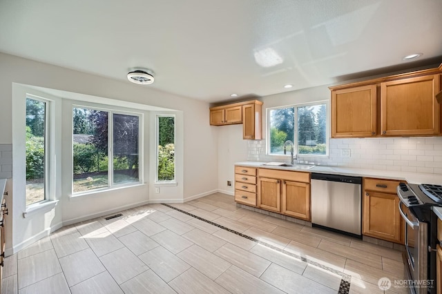 15223 SE 276th Pl, Kent, WA 98042 - kitchen with appliances with stainless steel finishes, decorative backsplash, light countertops, recessed lighting, and brown cabinetry