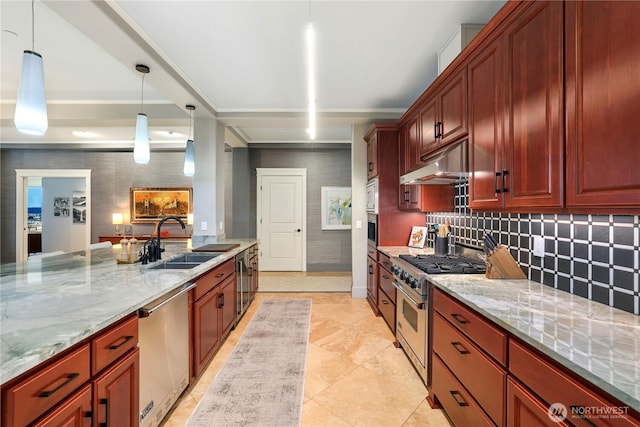 207 Broadway Unit 500, Tacoma, WA 98402 - kitchen with appliances with stainless steel finishes, under cabinet range hood, light stone countertops, backsplash, and pendant lighting