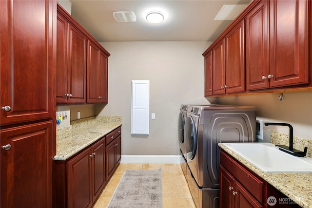 207 Broadway Unit 500, Tacoma, WA 98402 - washroom featuring cabinet space and washer and clothes dryer