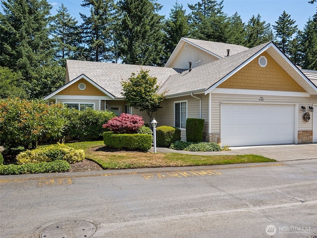 31867 48th Cir SW Unit 14A, Federal Way, WA 98023 - view of front facade with an attached garage, a shingled roof, concrete driveway, and stone siding