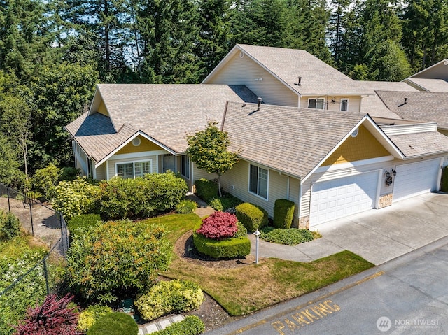 31867 48th Cir SW Unit 14A, Federal Way, WA 98023 - view of front of house with a shingled roof, a garage, concrete driveway, and stone siding