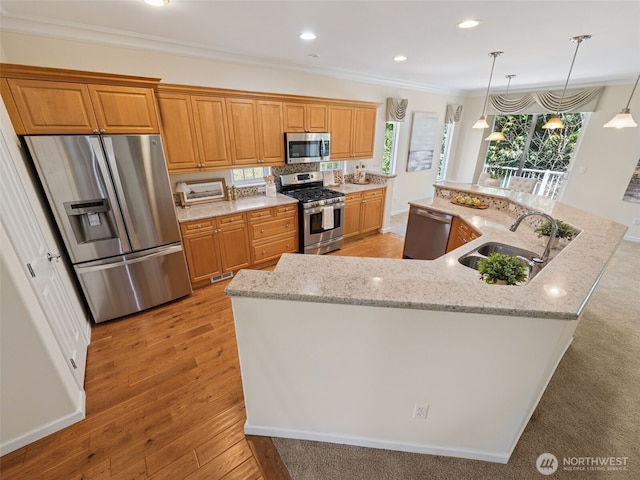 31867 48th Cir SW Unit 14A, Federal Way, WA 98023 - kitchen featuring stainless steel appliances, ornamental molding, a large island with sink, light stone counters, and light wood-style flooring
