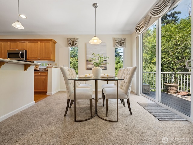 31867 48th Cir SW Unit 14A, Federal Way, WA 98023 - dining space featuring light colored carpet, healthy amount of natural light, and ornamental molding