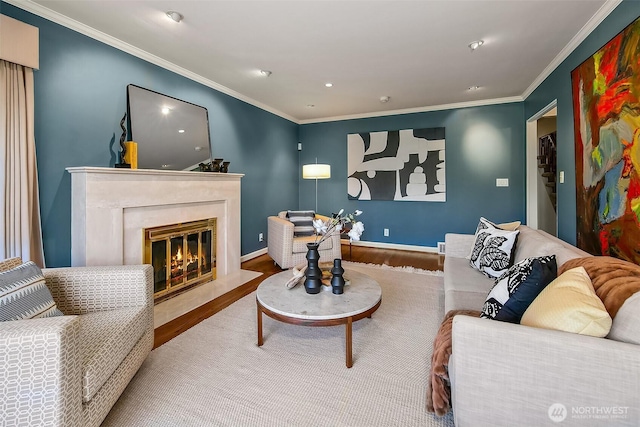 4412 43rd Ave NE, Seattle, WA 98105 - living room featuring wood finished floors, a high end fireplace, crown molding, and recessed lighting