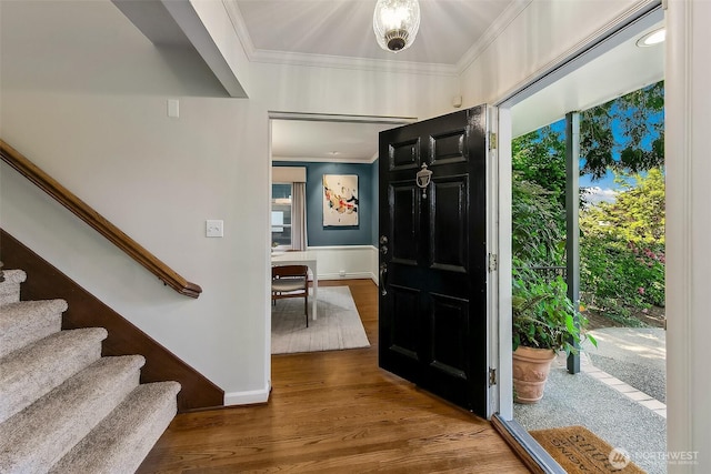 4412 43rd Ave NE, Seattle, WA 98105 - foyer entrance with crown molding, wood finished floors, and stairway