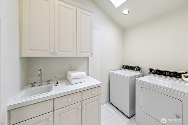 4412 43rd Ave NE, Seattle, WA 98105 - laundry area with cabinet space, washing machine and clothes dryer, a skylight, and recessed lighting