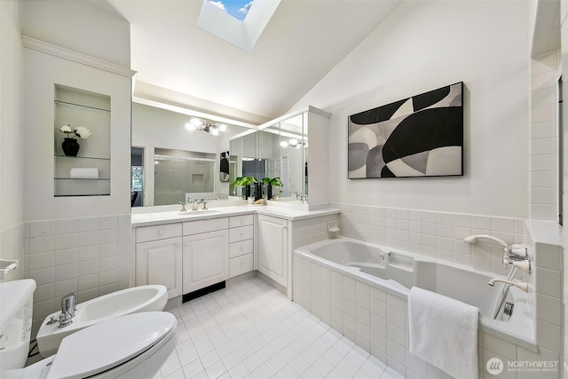 4412 43rd Ave NE, Seattle, WA 98105 - full bathroom with a bidet, a stall shower, vanity, a skylight, and a bath