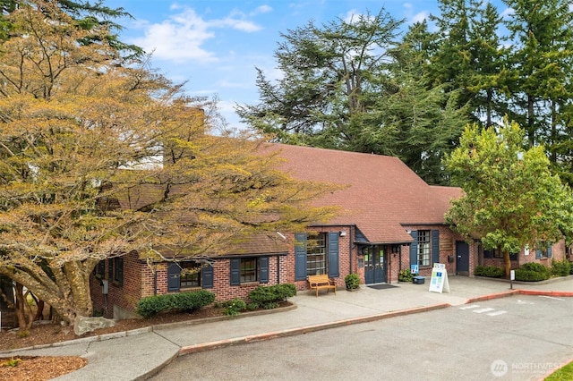 4412 43rd Ave NE, Seattle, WA 98105 - view of front facade featuring brick siding and a shingled roof