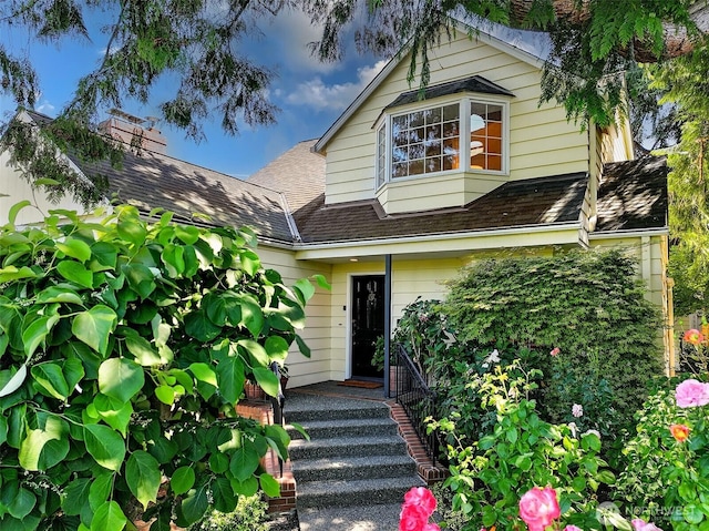 4412 43rd Ave NE, Seattle, WA 98105 - view of front of home featuring roof with shingles and a chimney
