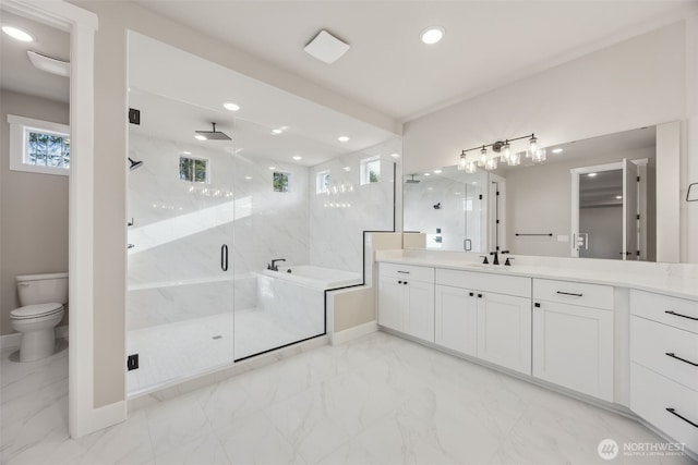 10630 134th Dr NE Unit 112, Lake Stevens, WA 98258 - bathroom featuring vanity, a marble finish shower, a bath, marble look tiles, and recessed lighting