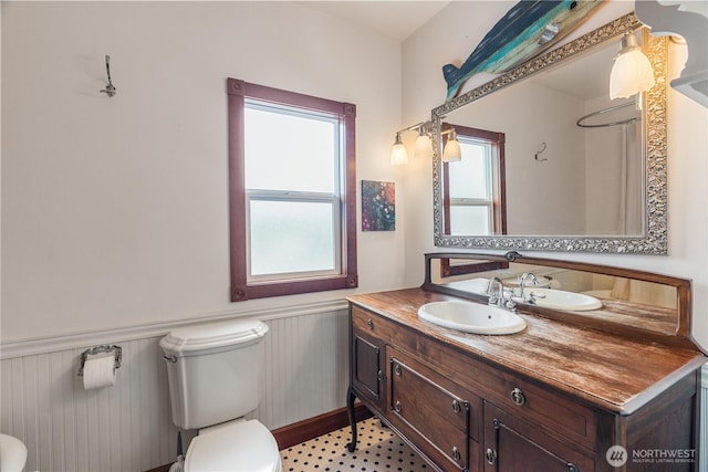 404 W Marcy Ave, Montesano, WA 98563 - bathroom featuring wainscoting and vanity