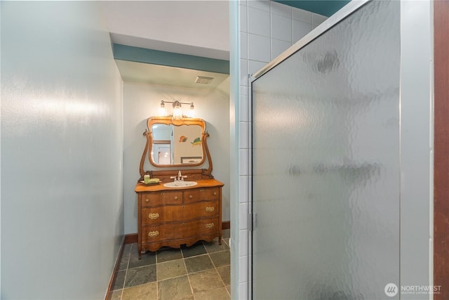 404 W Marcy Ave, Montesano, WA 98563 - bathroom with vanity, a shower stall, and stone finish flooring