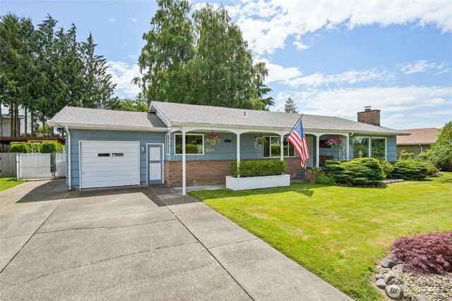 910 Crestline Dr, Longview, WA 98632 - single story home with an attached garage, driveway, a porch, brick siding, and roof with shingles