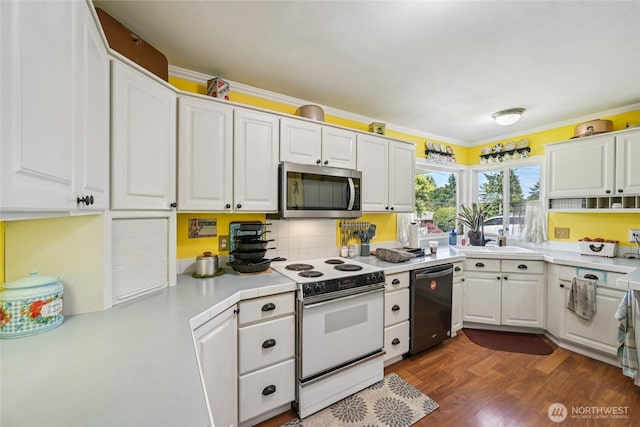 910 Crestline Dr, Longview, WA 98632 - kitchen featuring stainless steel microwave, electric range, dishwasher, white cabinetry, and dark wood-style floors