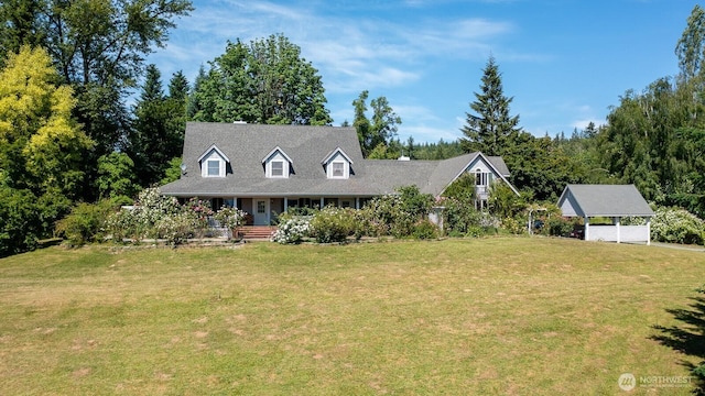 909 308th St NE, Stanwood, WA 98282 - cape cod home with a front lawn and covered porch