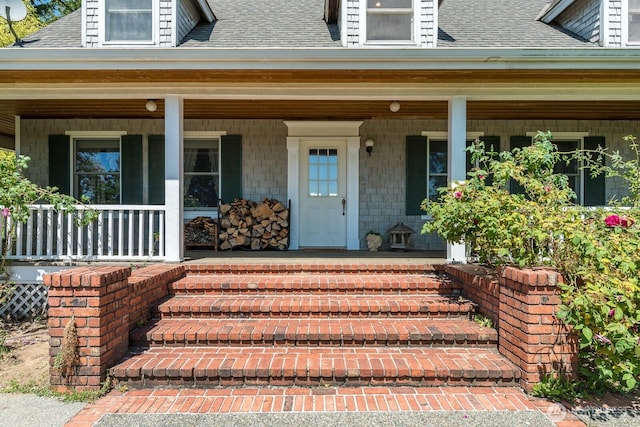 909 308th St NE, Stanwood, WA 98282 - property entrance with a shingled roof and a porch
