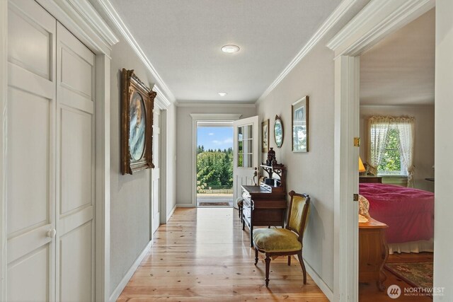 909 308th St NE, Stanwood, WA 98282 - hallway featuring ornamental molding and light wood-style flooring