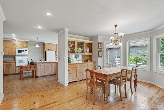 909 308th St NE, Stanwood, WA 98282 - dining space featuring crown molding, light wood-type flooring, a chandelier, and recessed lighting