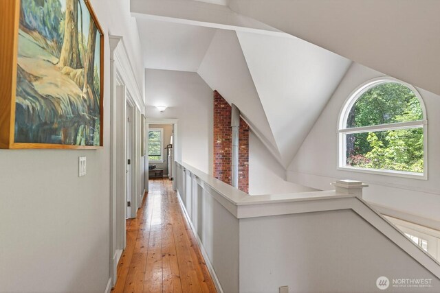 909 308th St NE, Stanwood, WA 98282 - hall with light wood finished floors, lofted ceiling, and an upstairs landing