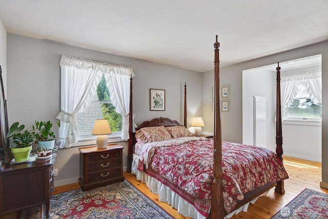 909 308th St NE, Stanwood, WA 98282 - bedroom with wood finished floors and baseboards