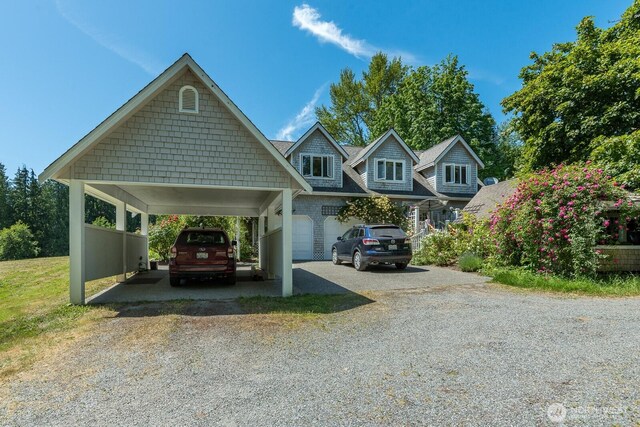 909 308th St NE, Stanwood, WA 98282 - view of front of home featuring gravel driveway and a carport