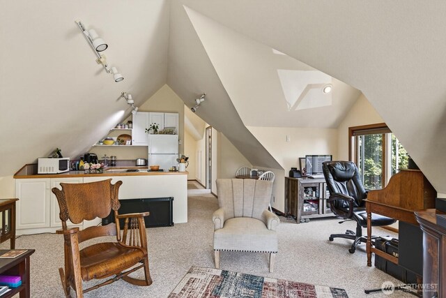 909 308th St NE, Stanwood, WA 98282 - office area with vaulted ceiling, rail lighting, and light colored carpet
