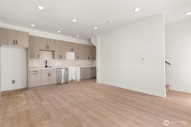 6544D Latona Ave NE, Seattle, WA 98115 - kitchen featuring stainless steel dishwasher, recessed lighting, backsplash, light wood-style flooring, and light countertops