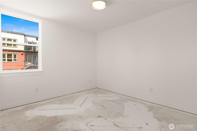 6544D Latona Ave NE, Seattle, WA 98115 - unfurnished room featuring baseboards and unfinished concrete flooring