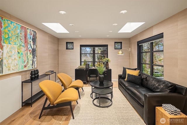 8457 NE 7th St, Medina, WA 98039 - living area featuring a skylight, wood finished floors, plenty of natural light, and recessed lighting