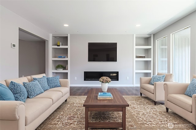 3 Burning Tree Dr Unit 3, Yakima, WA 98902 - living area featuring built in features, wood finished floors, a glass covered fireplace, and recessed lighting