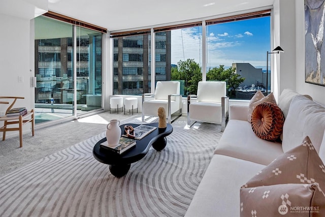 2000 1st Ave Unit 703, Seattle, WA 98121 - living area with a wall of windows and carpet