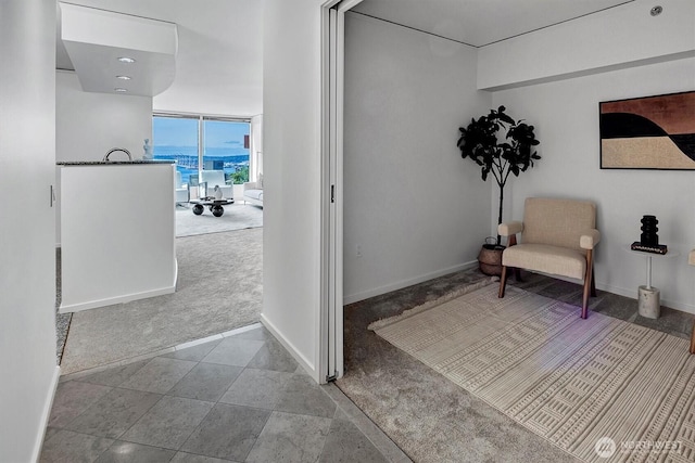 2000 1st Ave Unit 703, Seattle, WA 98121 - sitting room with carpet flooring and baseboards